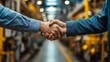 © Majed - A factory worker and a CEO shaking hands, symbolizing growth through teamwork.