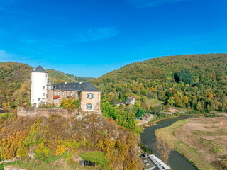 Aerial view of Kreuzberg castle in Altenahr Germany with Baroque palace, medieval round keep above a river