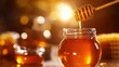 © Sunijsa - A jar of honey is poured into a spoon