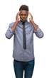 © Krakenimages.com - Young african american business man over isolated background with hand on head for pain in head because stress. Suffering migraine.