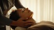 © siyons - Relaxed woman receiving neck and shoulder massage from therapist.