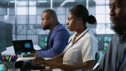 Poster - woman putting headphones on in server room, developing disaster recovery plans ensuring minimal down