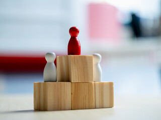 Aufkleber - Leadership dynamics wooden figures representing teamwork office conceptual art indoor close-up view