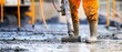 © Morto - A close-up of a construction worker operating a concrete pump to pour foundations for a high-rise building, Concrete pumping scene, Urban development style