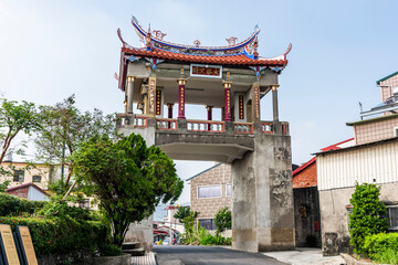 Wall Mural - Building view of the Meinong East Gate Tower in Kaohsiung, Taiwan. The tower was constructed using Qing Dynasty architecture.