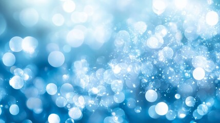 Abstract bokeh effect with soft circles of light in cool blue tones, blurred and dreamy