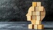 © Kultivad - Business ethics concept with wooden cubes symbolizing integrity and moral values inside a human head reflecting sustainable corporate culture.