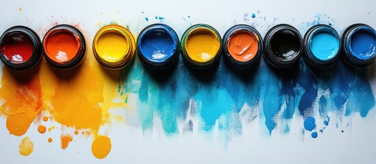 Poster - Vibrant art supplies including paints and brushes arranged artistically with colorful splashes on a creative workspace backdrop.