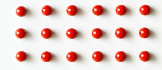 Poster - Red balls arranged in a grid pattern on a clean white background creating a modern minimalist aesthetic design.