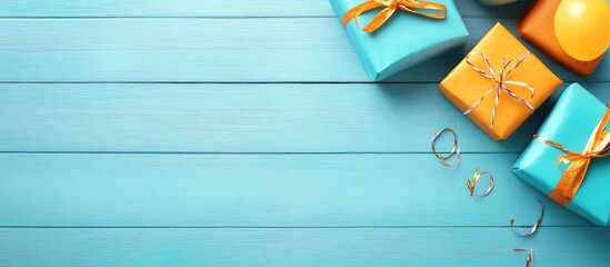 Poster - Brightly colored birthday gift boxes and festive decorations on a blue wooden backdrop creating a cheerful celebration atmosphere