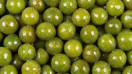 Poster - Fresh green peas arranged closely on a white surface showcasing their vibrant color and smooth texture in high detail.