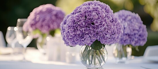 Aufkleber - Elegant purple wedding floral arrangement with hydrangeas at a reception featuring soft focus and ample copy space on the left side.