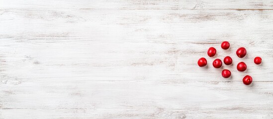 Poster - Fresh red apples scattered on a rustic white wooden background ideal for use in decoration postcards menus and invitations