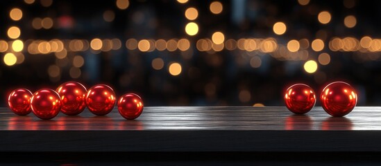 Aufkleber - Red Christmas ornaments on wooden surface with sparkling lights in the background creating a festive holiday ambiance.