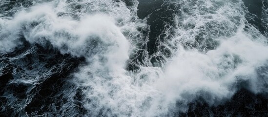 Poster - Aerial view of ocean waves crashing on the surface creating a mesmerizing textured pattern in deep blue water