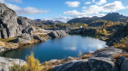 Poster - Scenic granite quarry landscape with tranquil waters and autumn foliage under a clear blue sky