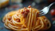 ©  AugmentArt - Delicious spaghetti with rich Bolognese sauce elegantly lifted on a fork showcasing Italian cuisine's flavorful essence