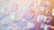 © aubriella - An inspiring image of various-sized, colorful bubbles floating and merging into a single, clear sphere against a soft