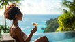 © Dara - A woman sipping a cocktail at a luxury hotel bar in an exotic destination, overlooking the ocean.