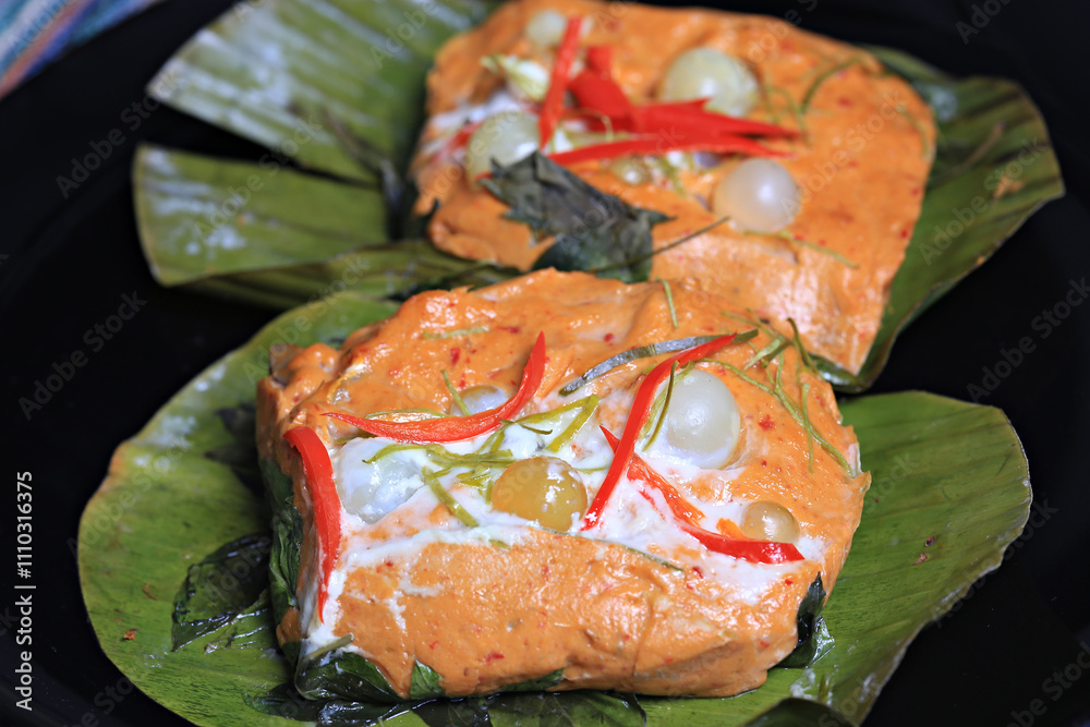 Cat Fish Roe Thai steamed seafood curry decorated with giant catfish roe on top ...
