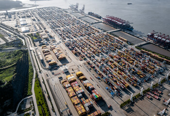 Fototapete - Cargo container port on seaside at sunrise