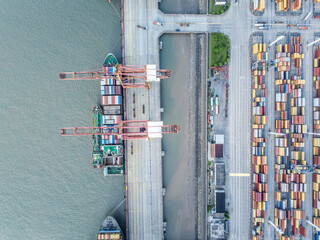 Fototapete - Cargo container port on seaside at sunrise