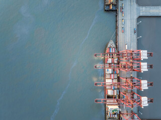 Fototapete - Aerial view of cargo container terminal cranes and cargo ship