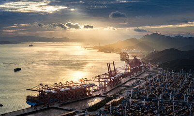 Aufkleber - Cargo container port and nature scenery by the sea at sunrise