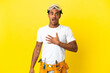 © luismolinero - African American electrician man over isolated yellow wall surprised and shocked while looking right