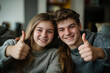 © luismolinero - Young caucasian couple at indoors with thumb up