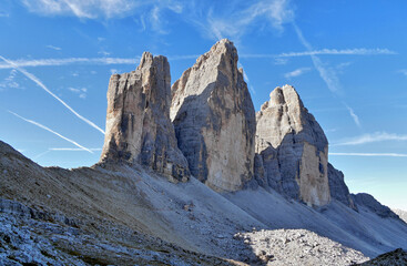 Wall Mural - Tre Cime high iconic rocks in Italian Dolomites autumn landscape