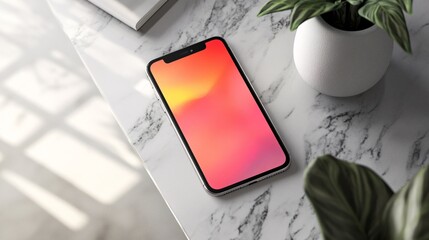 Aufkleber - Smartphone showing gradient screen lies on marble table next to plant and book