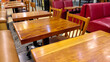 © Robert Yap - Jakarta, Indonesia - August 31, 2024 : Empty tables and chairs without visitors at one of the retail coffee drink sellers.
