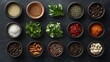 © addymawy - Assorted Spices Herbs And Nuts In Bowls Arranged On A Dark Surface