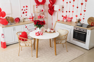 Wall Mural - Stylish interior of light kitchen decorated for Valentine's Day with beautiful roses, gifts and tea set on table