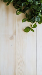 Poster - Green leaves on light wooden surface create natural contrast