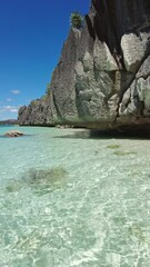 Wall Mural - beautiful view of tropical philippines island. white sand beach and bay with turquoise water, vertic