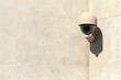 © JK_kyoto - Surveillance camera mounted on smooth wall, providing security and monitoring. design is modern and unobtrusive, blending seamlessly with architecture