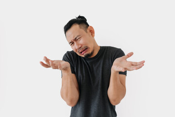 Wall Mural - Sad crying Asian freelance man bun hair in black on white.