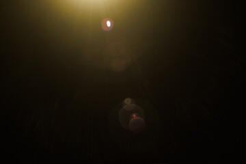 Fototapete - Easy to add lens flare effects for overlay designs or screen blending mode to make high-quality images. Abstract sun burst, digital flare, iridescent glare over black background.