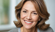 © Jānis Pūne - Headshot portrait of beautiful mid aged woman posing indoors with healthy toothy smile
