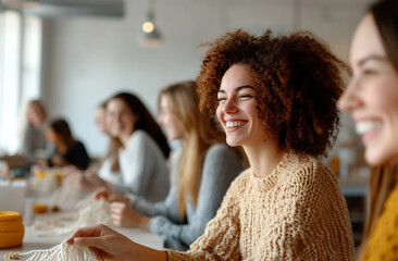 A group of friends comparing their macramé designs in a well-lit and cheerful studio