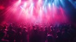 © ABIDZAR ALFAREZ - Crowd at concert, illuminated by stage lights.
