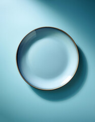 Wall Mural - Plate viewed from above, with symmetrical composition on light blue pastel