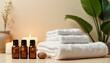 © schiers_images - A calming spa arrangement featuring essential oil bottles, soft towels, candles, and lush green plants, ideal for promoting relaxation and wellness. Perfect for massage or aromatherapy concepts.
