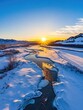 © Dragon42 - Stunning Winter Sunrise Over Snow-Covered River and Mountains in Serene Landscape
