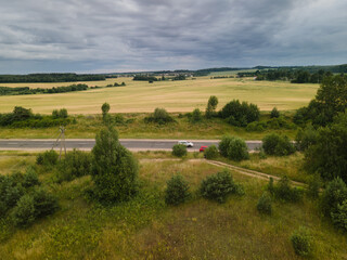 Wall Mural - Top view of the roads, landscape and roadside from the height of a flying drone. 