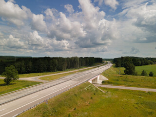 Wall Mural - Top view of the roads, landscape and roadside from the height of a flying drone. 