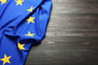 © New Africa - Flag of European Union on wooden background. Space for text