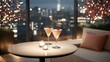 © Vera - Glasses of cocktails on a rooftop bar table at night